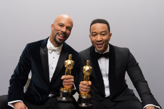 Lonnie Lynn (Common) and John Stephens (John Legend) pose backstage with the Oscar® for Achievement in music written for motion pictures (Original song) for work in “Selma.”  Todd Wawrychuk /©A.M.P.A.S.