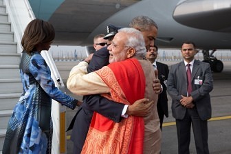 President Obama hugs Prime Minister Narendra Modi at Air Force Station Palam in New Delhi