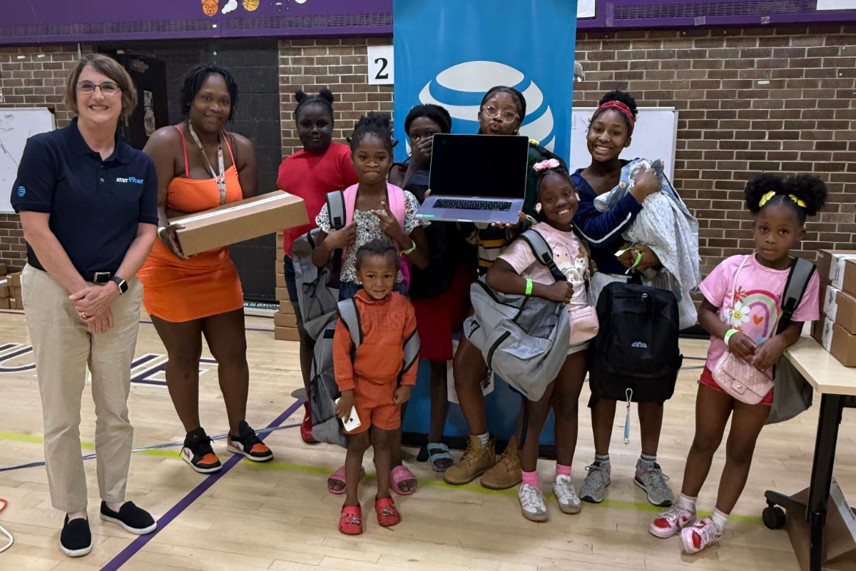 AT&T surprises Northside families with free MacBooks at Phyllis Wheatley back-to-school event